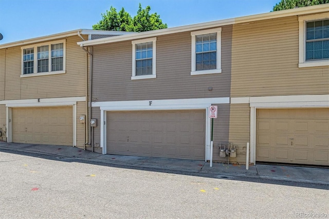 2881 W Long Dr Unit F, Littleton, CO 80120 - rear view of house with a garage