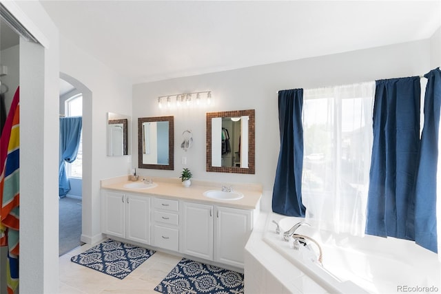 4715 E 127th Dr, Thornton, CO 80241 - bathroom featuring tile patterned flooring, double vanity, and a bath