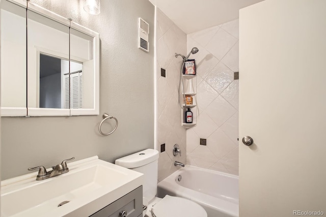 bathroom featuring vanity, toilet, and shower / washtub combination