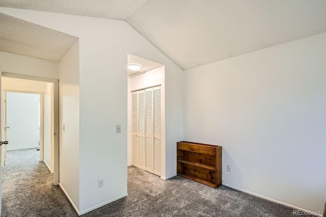 12935 W 64th Dr Unit D, Arvada, CO 80004 - unfurnished bedroom with carpet floors, vaulted ceiling, and a closet