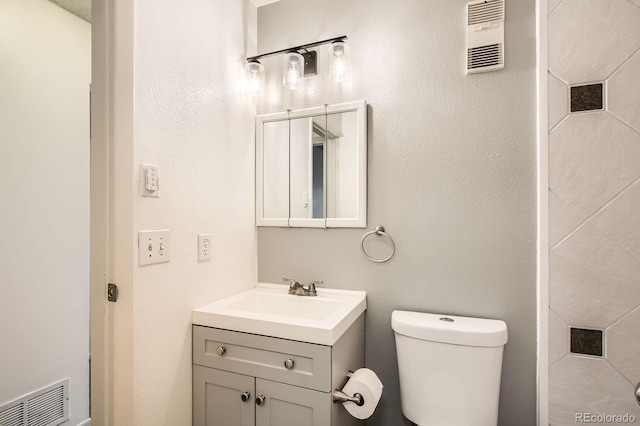12935 W 64th Dr Unit D, Arvada, CO 80004 - bathroom featuring vanity and toilet