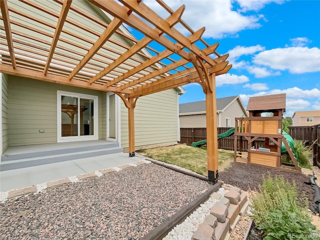 view of patio / terrace with a playground and a pergola