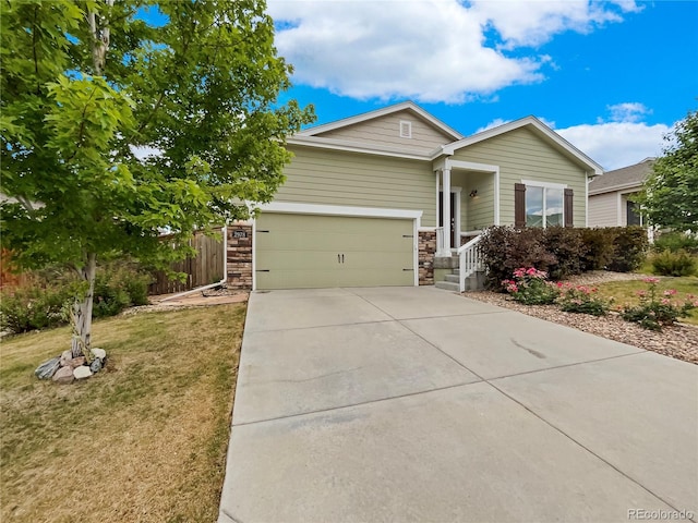 ranch-style home featuring a garage and a front yard