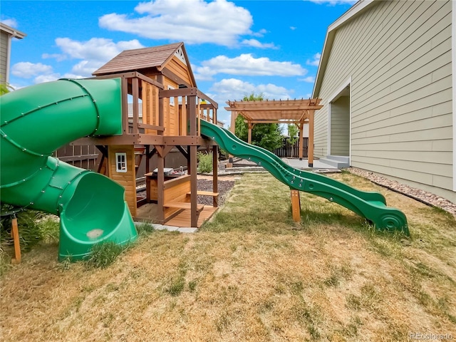 view of playground with a lawn and a pergola