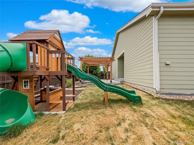 view of playground with a yard and a pergola