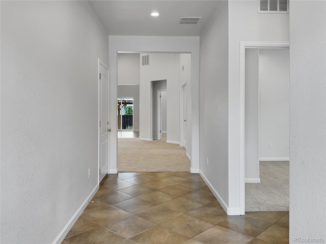 corridor featuring carpet flooring