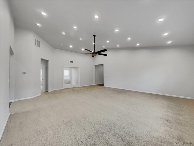 unfurnished room featuring light colored carpet and ceiling fan