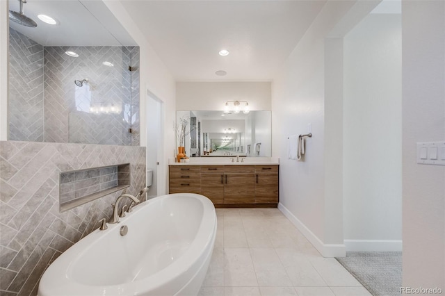 full bath with baseboards, a tub, tile patterned flooring, walk in shower, and vanity