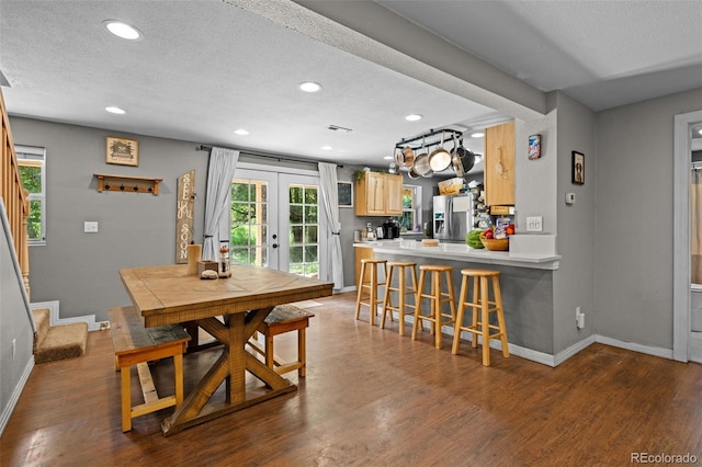 5211 Parmalee Gulch Rd, Indian Hills, CO 80454 - dining space with french doors, a textured ceiling, recessed lighting, wood finished floors, and stairs