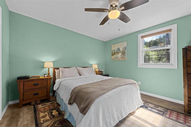 5211 Parmalee Gulch Rd, Indian Hills, CO 80454 - bedroom featuring wood finished floors and ceiling fan