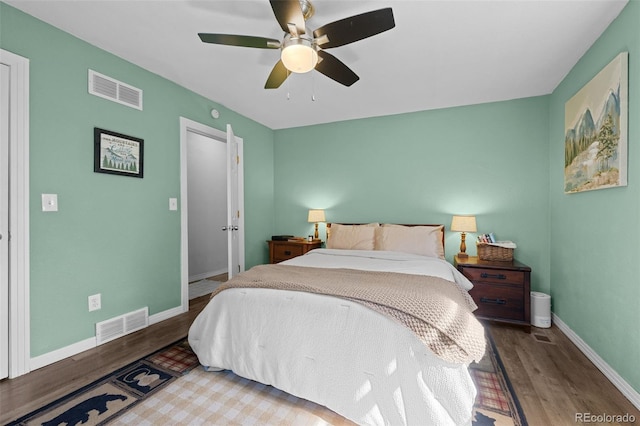 5211 Parmalee Gulch Rd, Indian Hills, CO 80454 - bedroom with wood finished floors and a ceiling fan