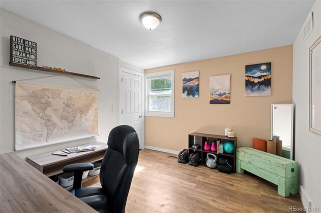 5211 Parmalee Gulch Rd, Indian Hills, CO 80454 - home office with wood finished floors and baseboards