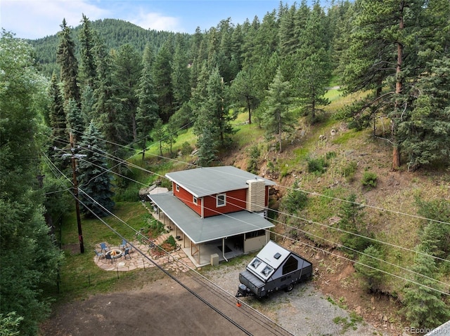 5211 Parmalee Gulch Rd, Indian Hills, CO 80454 - view of subject property featuring a forest