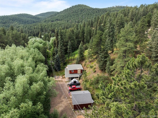 5211 Parmalee Gulch Rd, Indian Hills, CO 80454 - view from above of property with a heavily wooded area and a mountain backdrop