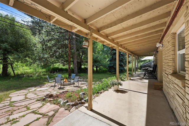 5211 Parmalee Gulch Rd, Indian Hills, CO 80454 - view of patio featuring a fire pit and view of scattered trees