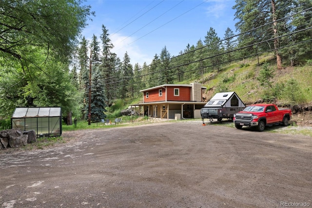 5211 Parmalee Gulch Rd, Indian Hills, CO 80454 - view of dirt / gravel road with an exterior structure