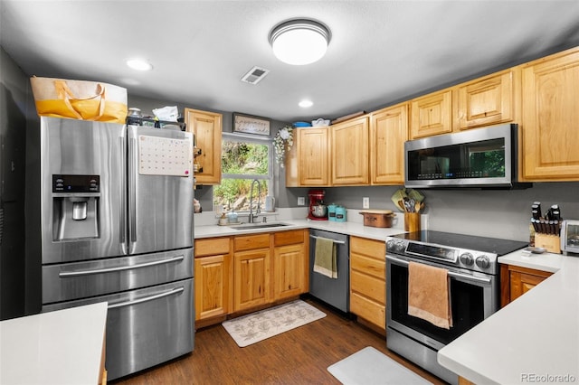 5211 Parmalee Gulch Rd, Indian Hills, CO 80454 - kitchen featuring appliances with stainless steel finishes, light countertops, dark wood-style floors, and recessed lighting