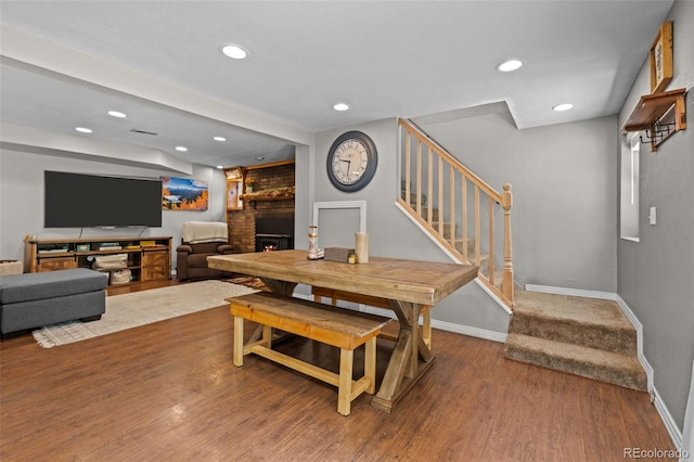 5211 Parmalee Gulch Rd, Indian Hills, CO 80454 - dining space featuring recessed lighting, stairs, wood finished floors, and a fireplace