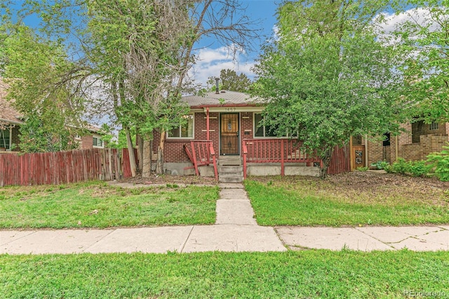 1457 S Franklin St, Denver, CO 80210 - view of front of home with brick siding and covered porch