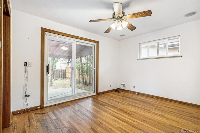 1457 S Franklin St, Denver, CO 80210 - unfurnished room with wood finished floors, baseboards, and a ceiling fan