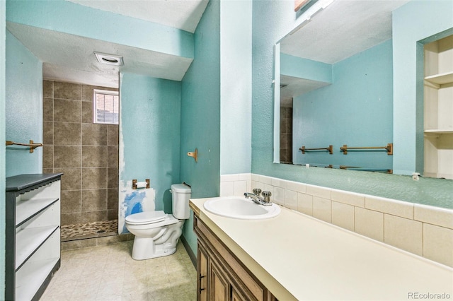 1457 S Franklin St, Denver, CO 80210 - full bathroom with vanity, a tile shower, and toilet