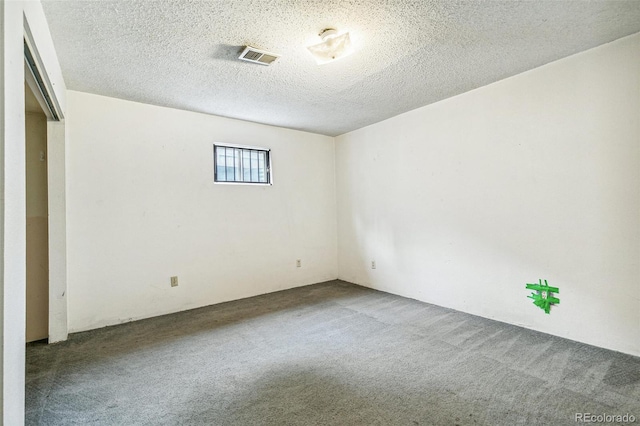 1457 S Franklin St, Denver, CO 80210 - empty room featuring carpet flooring and a textured ceiling