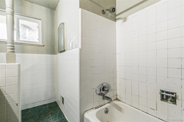 1457 S Franklin St, Denver, CO 80210 - full bathroom with bathtub / shower combination, a textured wall, and wainscoting