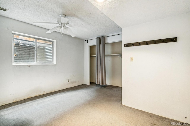 1457 S Franklin St, Denver, CO 80210 - unfurnished bedroom with carpet, two closets, a textured ceiling, and ceiling fan