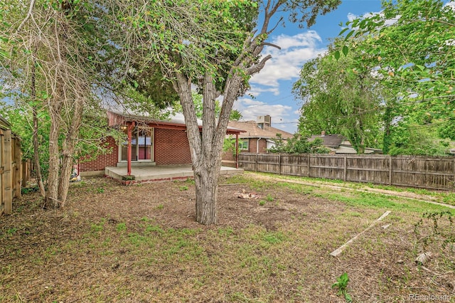 1457 S Franklin St, Denver, CO 80210 - fenced backyard featuring a patio area
