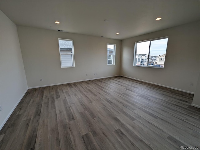 empty room with wood-type flooring