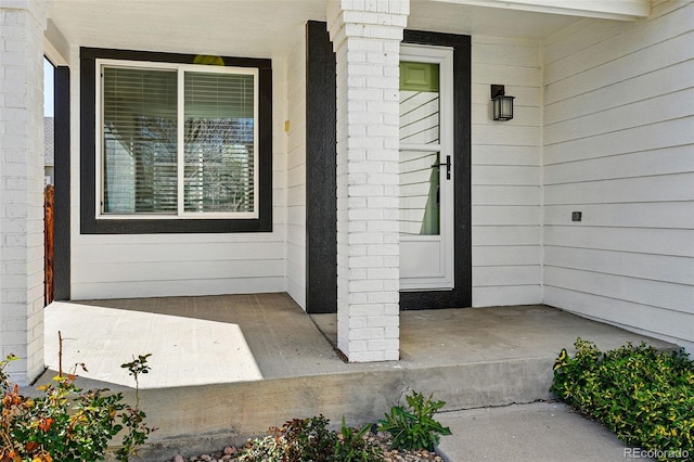 entrance to property with covered porch