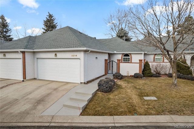 ranch-style house with a garage and a front yard