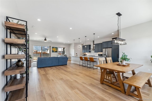 dining space featuring recessed lighting, light wood finished floors, and ceiling fan