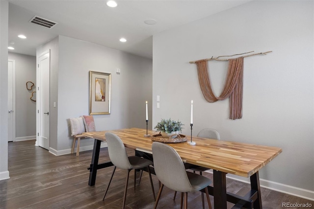 dining space featuring dark hardwood / wood-style flooring