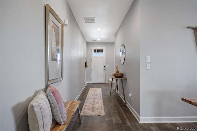 hallway with dark wood-type flooring