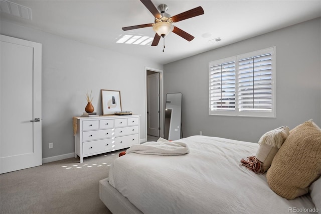 bedroom featuring ceiling fan and light carpet