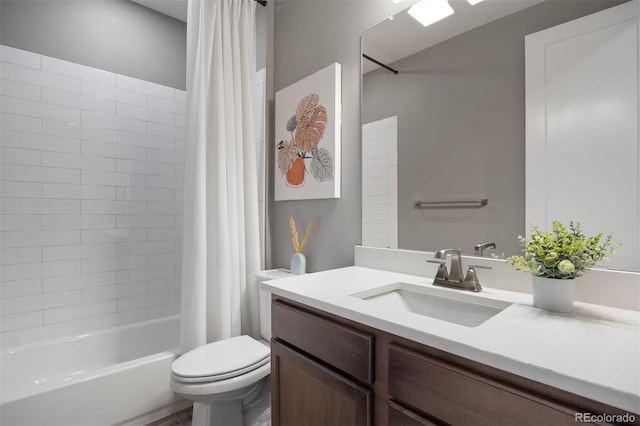 full bathroom featuring shower / bath combo, vanity, and toilet