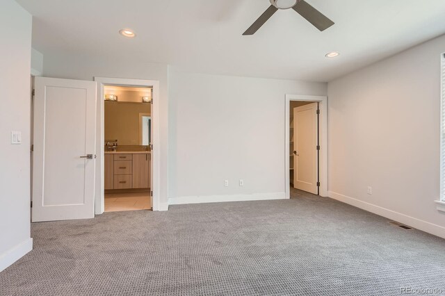 1840 Irving St, Denver, CO 80204 - unfurnished bedroom with carpet floors, baseboards, recessed lighting, ceiling fan, and ensuite bath