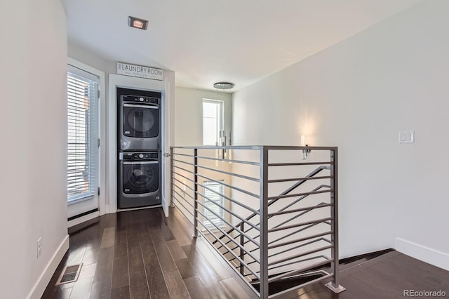 1840 Irving St, Denver, CO 80204 - entryway with stacked washer / dryer, baseboards, and dark wood-style floors