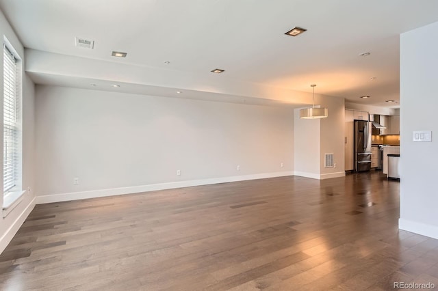 1840 Irving St, Denver, CO 80204 - empty room with wood finished floors, baseboards, and recessed lighting