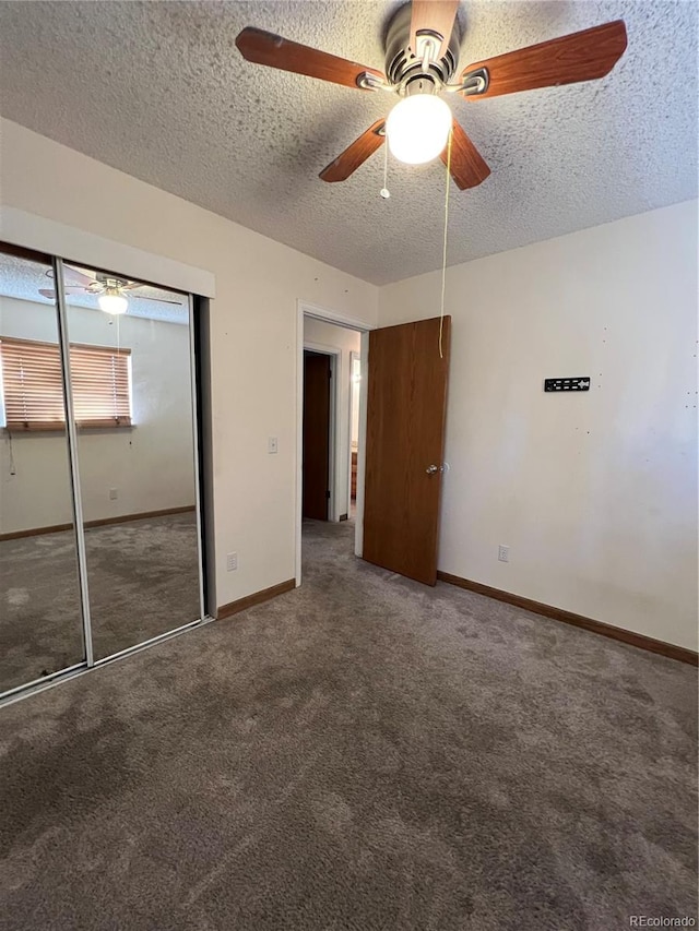 unfurnished bedroom with a closet, a textured ceiling, carpet floors, and ceiling fan