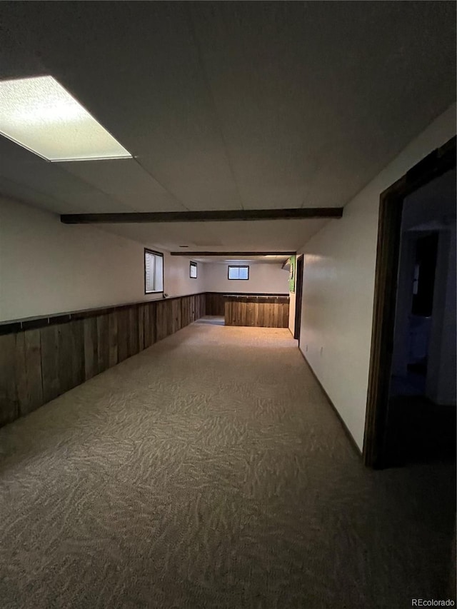 corridor with wooden walls and carpet