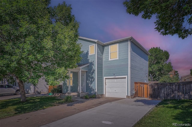 1272 Bluebird St, Brighton, CO 80601 - traditional-style home featuring driveway and an attached garage