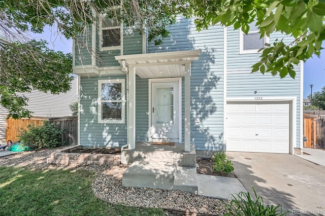 1272 Bluebird St, Brighton, CO 80601 - entrance to property with a garage and driveway