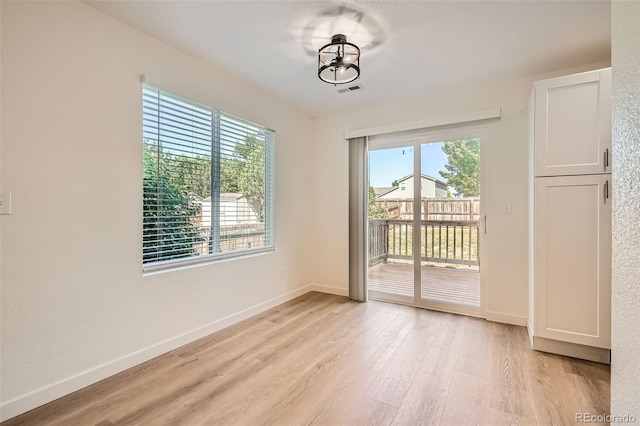 1272 Bluebird St, Brighton, CO 80601 - spare room with light wood-style flooring and plenty of natural light