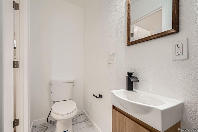 1272 Bluebird St, Brighton, CO 80601 - bathroom featuring marble finish flooring and vanity