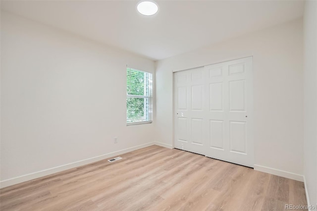 1272 Bluebird St, Brighton, CO 80601 - unfurnished bedroom featuring light wood-type flooring and a closet