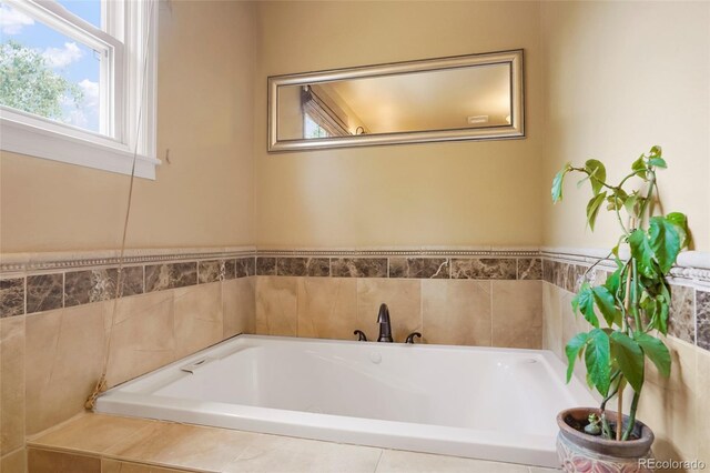 bathroom featuring tiled bath