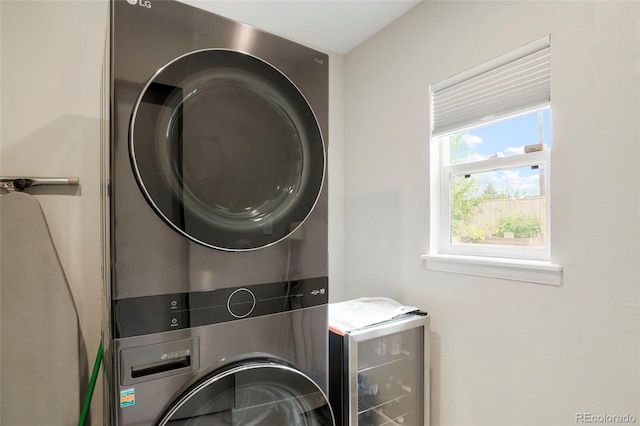 laundry room with stacked washer and clothes dryer