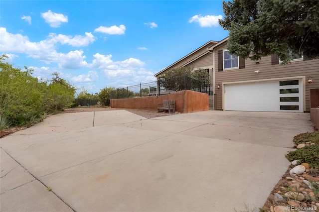 view of side of property with a garage